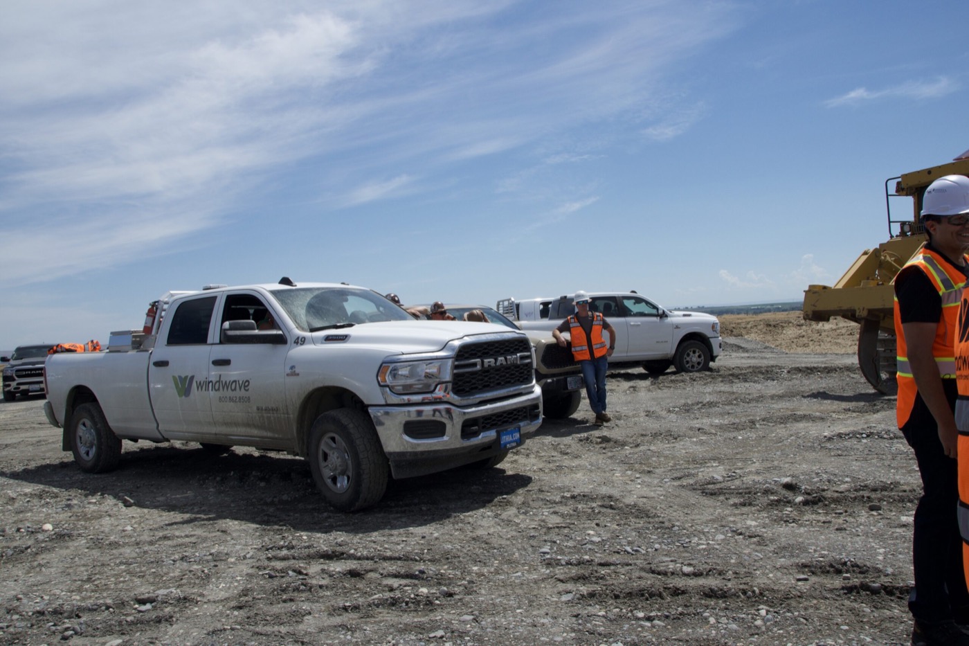 Windwave crew trucks and personnel at a project site